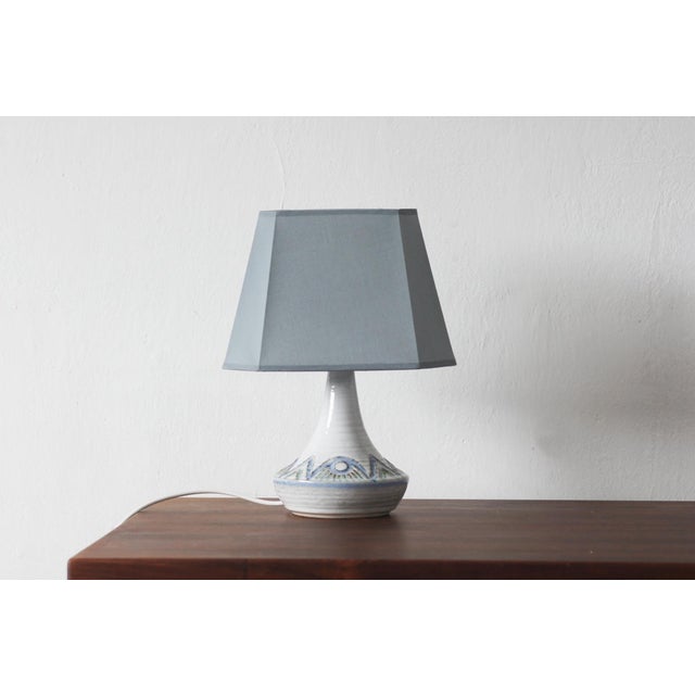 This ceramic lamp, produced by Søholm, is a unique example of Bornholm craftsmanship, where modernist simplicity meets the...
