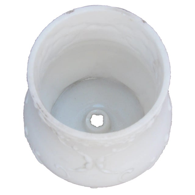 This elegant example of French opaline glass probably started life as an element of a expensive light fixture. We thought...