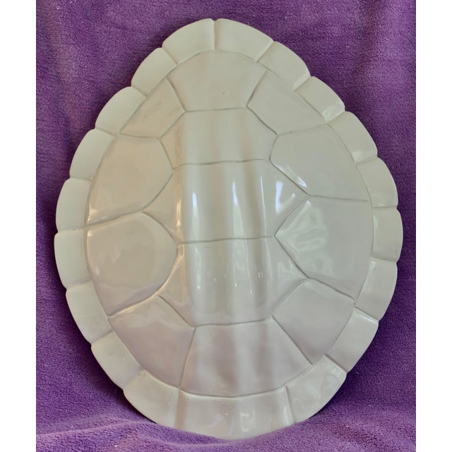 Nate Berkus Faux Tortoise Shell. It can be mounted on the wall or placed on a table.