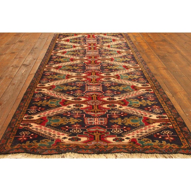 Genuine hand-knotted Middle Eastern rug runner | Size: 305 cm x 120 cm | Knot density: approx. 90.000 knots/m² | Material:...