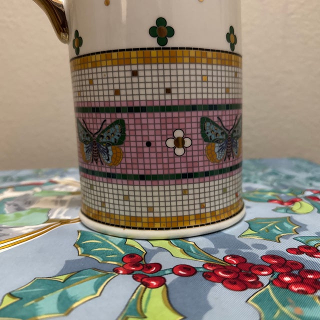 This stunning piece is the Anthropologie Bistro Tile Stoneware 24k Gold Accent Pitcher: Garden Edition. Part of the highly...