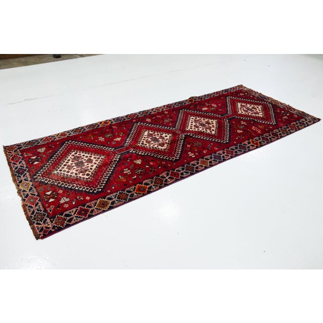 Tribal Vintage Persian Hand-Knotted Wool Rug Featuring a Red Field and a Tribal Design For Sale - Image 3 of 10