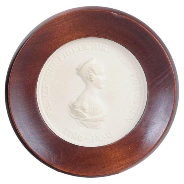 Meissen Biscuit plaque, c. 1970s. Circular relief plaque in white biscuit porcelain with a classical profile portrait and...