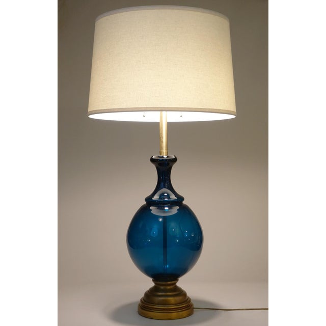 A massive and sculpturally sensual hand blown thick Murano Art Glass Blenko style form with Brass hardware table lamp...