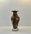 A beautifully illustrated vintage glass vase in amphora-style. A gold-colored amphora-shaped base topped with the first...