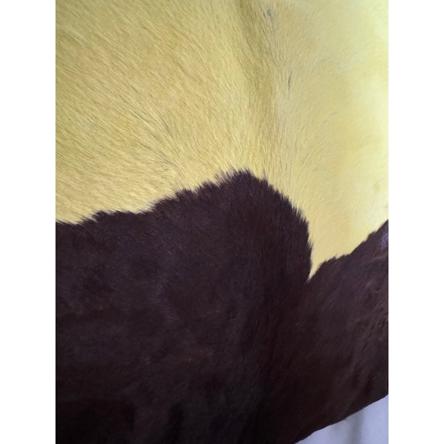 Rare cowhide natural dyed, neon yellow and coffee brown accent pillow.