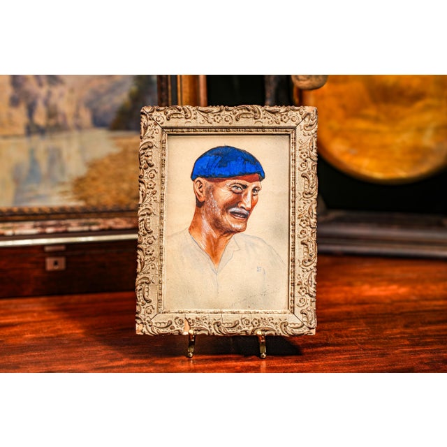 This captivating French gouache painting, dating circa 1915, showcases a skilled portrayal of a cheerful man wearing a...