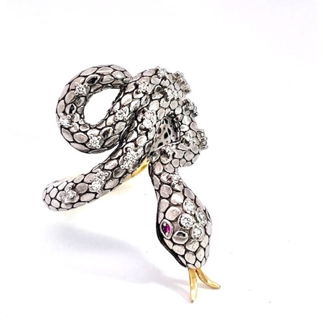 This amazing ring comes out of Ireland and is both Gold and Silver and studded with Diamonds. It has a gold tongue and two...