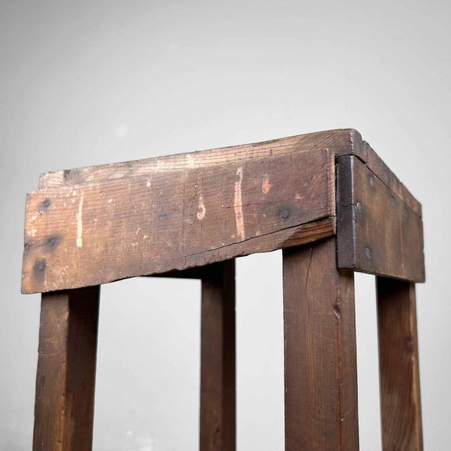 Decorative wooden stool from the 1930s. Dimensions: height 53 cm, 24 cm x 24 cm. This handcrafted wooden stool is a...