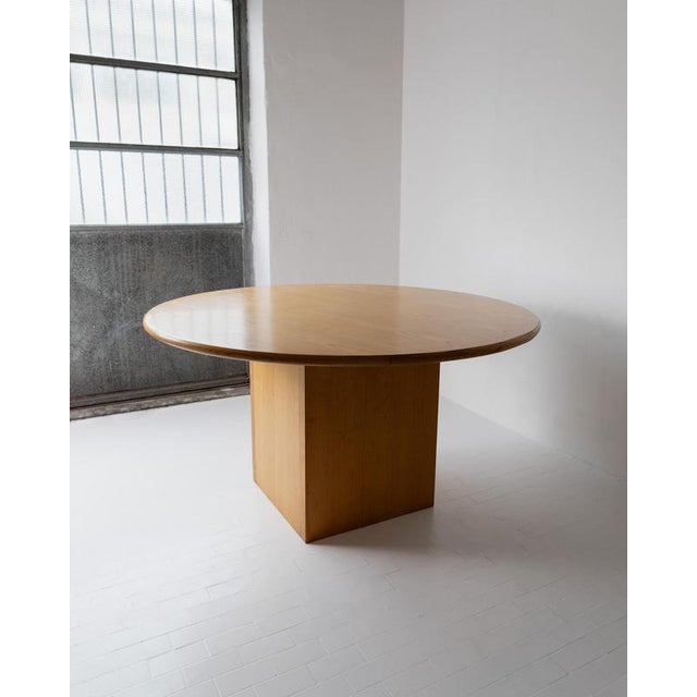 This vintage large round wooden table from the 1980s is a beautifully handcrafted Italian piece, designed as a striking...