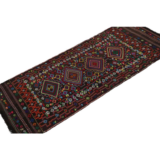 Handwoven in wool, originating from Afghanistan circa 1950-1960, its 2x5 size and design may signify origins as a table...