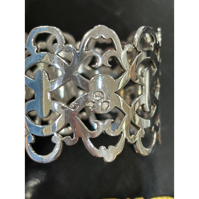 This intricately designed sterling silver Victorian napkin ring is pierced in such a way as to resemble lace. It is...