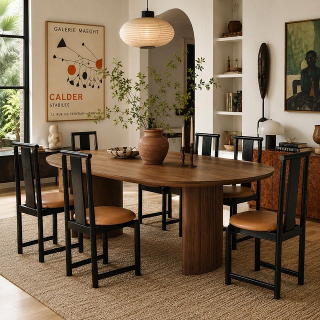 A sculptural set of six postmodern dining chairs by BiF, dating to the 1980s. Tall, sharply profiled backs and black-...