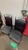 set of four brutalist dining chairs manufactured by Douglas Furniture of California, Inc. Each chair has black faux...