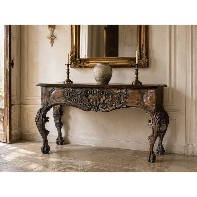 Beautiful vintage Italian Baroque style console table featuring an elaborately hand-carved wood with dramatic scrolling...