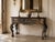 Beautiful vintage Italian Baroque style console table featuring an elaborately hand-carved wood with dramatic scrolling...