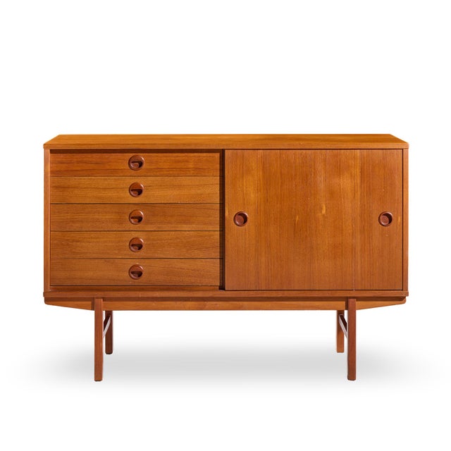 Dux Mid Century Danish Teak Petite Sliding Door Credenza This credenza measures: 47.75 wide x 18.5 deep x 31.25 inches...