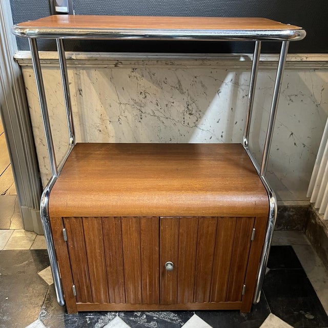 Modernist art deco bauhaus-style sideboard, chrome-plated steel frame, 2-door pedestal and walnut wood shelf, circa 1930....