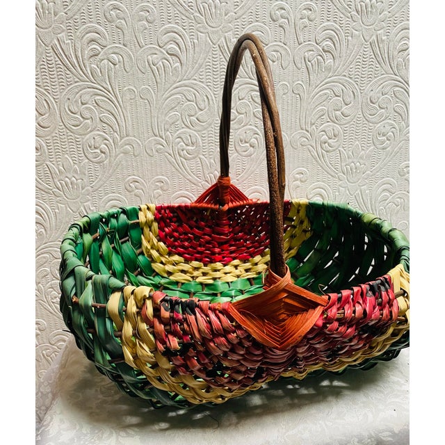 Fabulous vintage antique hand woven watermelon large buttocks basket. It is made a little crooked, so sets a little off,...