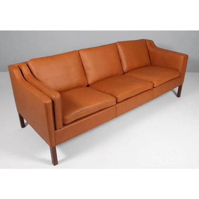 Børge Mogensen three-seat sofa new upholstered with walnut elegance aniline leather. Legs of teak. Model 2213, made by...