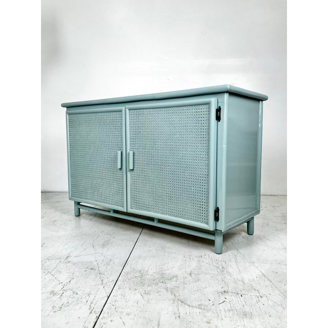 Newly lacquered vintage rattan cabinet/credenza/sideboard. Custom handmade piece that has been newly refinished in...