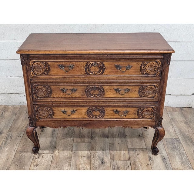This is a stunning vintage French Provincial Louis XV style carved commode, dresser, or chest of drawers. Wood appears to...