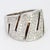 This is a large 18k white gold ring in an art deco style with a "Zig-Zag" design. The ring sports one hundred and fifteen...