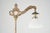 Victorian style bridge arm floor lamp made of brass plated cast iron and steel with a fluted milk glass shade. It features...