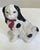 A charming large Staffordshire style black and white spaniel with a sweet ribbon around its neck. So decorative!