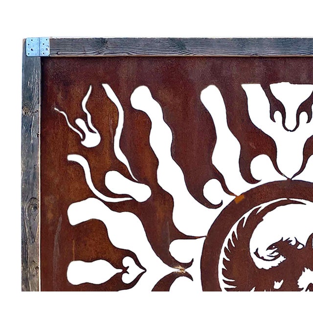 C. 1950's decorative, hand-cut steel panel of impressive scale featuring a flame design and central roundel with the image...