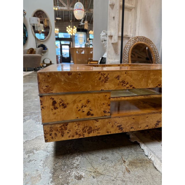 Striking mid-century modern coffee table by Willy Rizzo, crafted in richly figured burl wood veneer with a bold geometric...