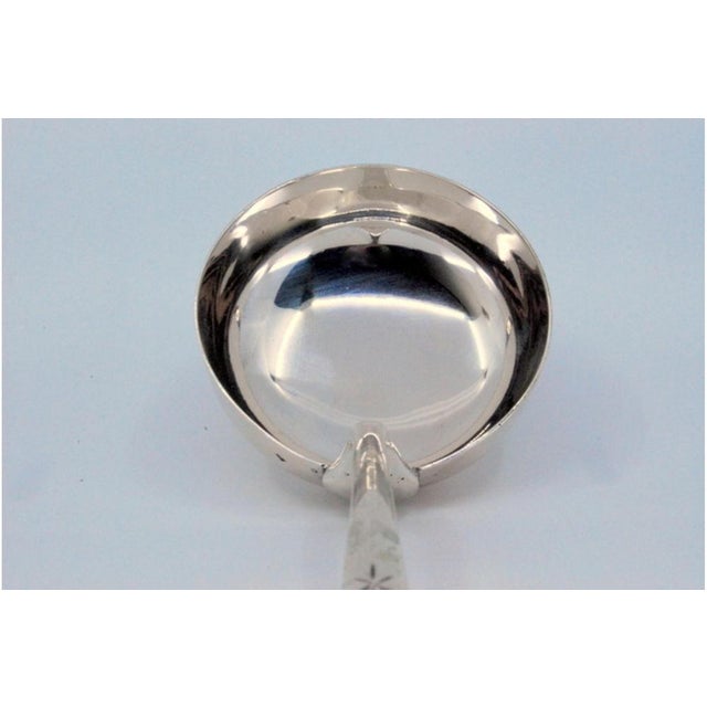 Silver Soup Ladle with Engravings, in Very Good conditions. Designed 1890 to 1919 This piece has an attribution mark, I am...