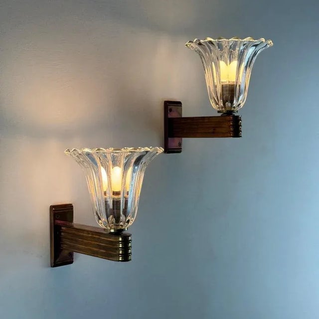 An enchanting pair of wall sconces attributed to Ercole Barovier for Barovier & Toso, dating to the 1940s — masterfully...