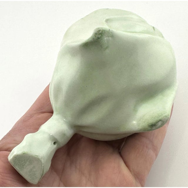 Delicate antique porcelain tussie mussie, hand painted with lavender and purple violets against a soft light green...