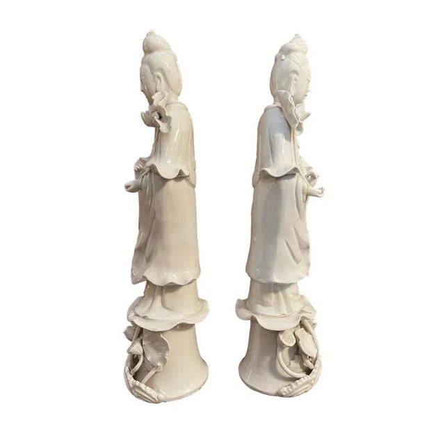 Pair of Guanyin, ceramic statues, China, 19th century Refined pair of Chinese ceramics, depicting female figures on an...