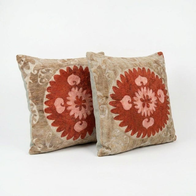 This beautiful 27'' x 27'' & 26'' x 28'' hand-embroidered Suzani pillow cover set was made from authentic Uzbek cotton...