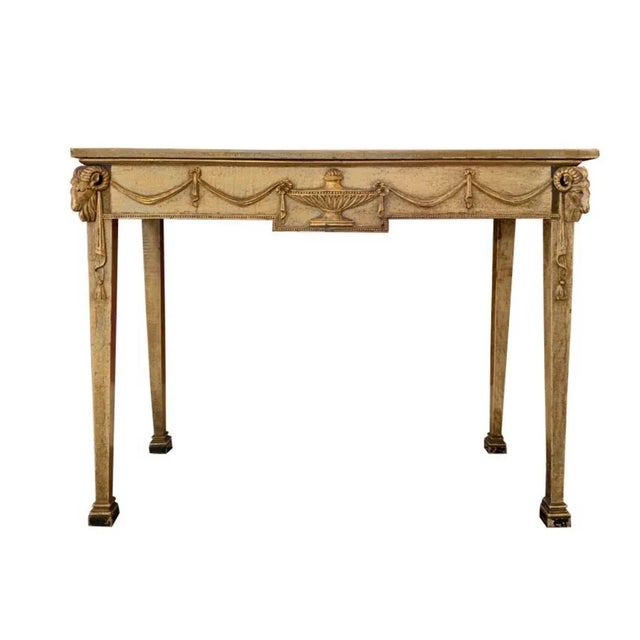 An identical pair of Italian beige and black painted console tables Sold as a set of two Cippollino Dorato marble top with...