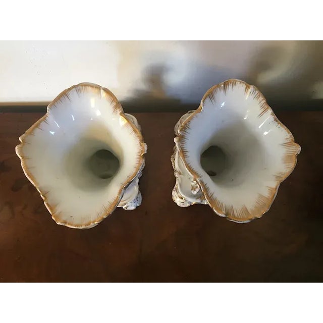 Large pair antique French Empire 19th century Paris porcelain rhyton mantel vases with eagle heads and cornucopia. The...