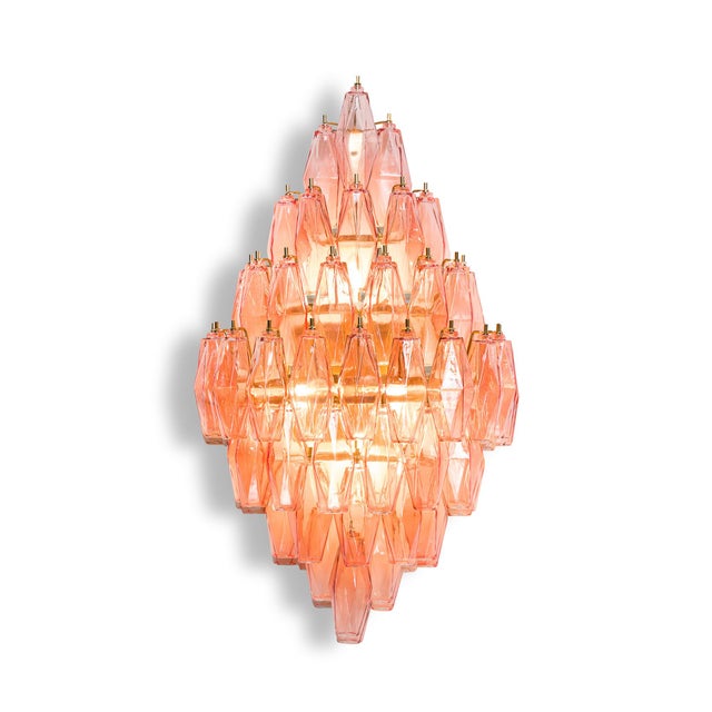 A vintage inspired wall light formed from beautiful, coloured polyhedrons in Pink, Amber, Lilac and Smoked glass and...