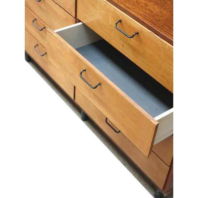 Large vintage wall unit from the 1960s with a functional and timeless design. The unit features multiple elements with...