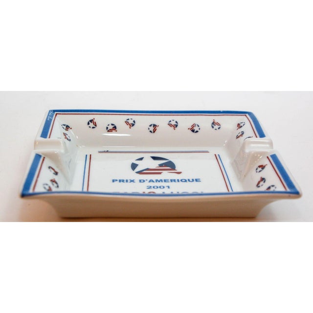 Collectible sport porcelain ashtray in a rectangular shape featuring design and color of the "Prix d'Amérique 2001" France...