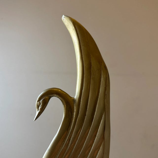 This vintage solid brass swan adds a timeless touch of sophistication to any interior. With its graceful curves and warm...