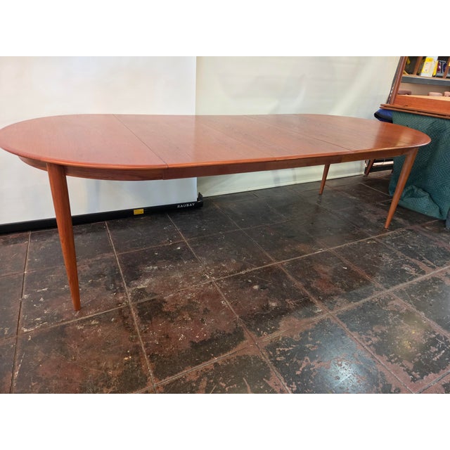 A nice huge teak dining table. From the 1960s 45 round. One leaf 65, two leaves 85, three leaves 105 nearly 9 feet. Can be...