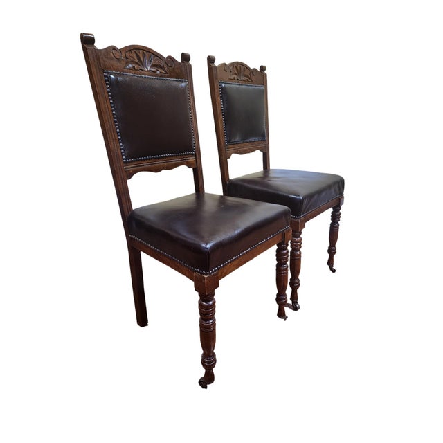 Gorgeous pair of English Victorian period oak dining chairs in Gothic Revival style, excellent condition to both. Carved...