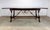 A fabulous Theodore Alexander dining table with multi-wood parquet top and medium to dark auburn brown satin finish. Metal...