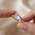 Experience captivating radiance with this delicate bypass ring set with a glowing marquise-cut Rainbow Moonstone. Designed...