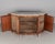 A 19th century English Victorian burled of walnut, serpentine front, white marble top sideboard. Original shaped white...