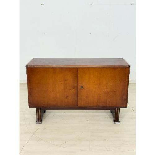 High-quality vintage chest of drawers from the 1960s. This piece of furniture impresses with its typical mid-century...