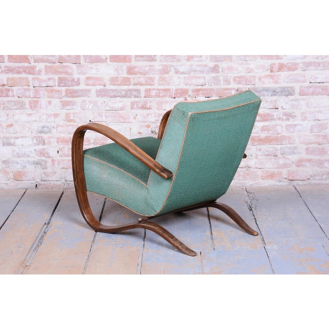 Textile designer: antonín kybal model: h-269 this exceptionally iconic pair of armchairs (model h-269) in the distinct art...
