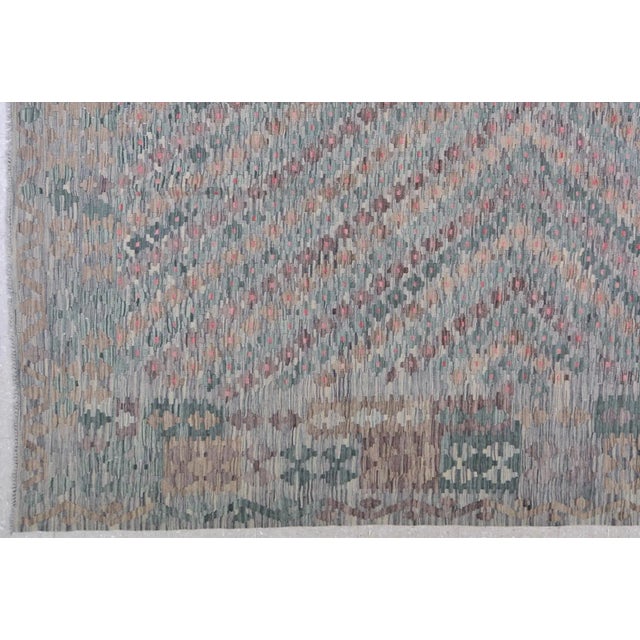 Hand-knotted with care using traditional rug-making techniques, this wool rug blends timeless craftsmanship with a modern...